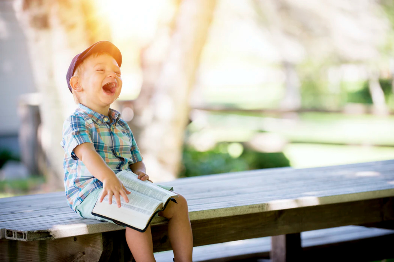 boy-laughing-on-the-bench